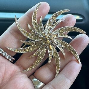 Gold Starburst Brooch with Rhinestones